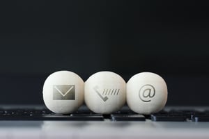 icon on wooden ball of website and internet contact us page concept on computer laptop keyboard icon on wooden ball of website and internet contact us page concept on computer laptop keyboard